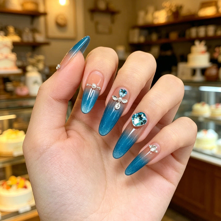Artificial nails with glitter and rhinestone embellishments Kalsten