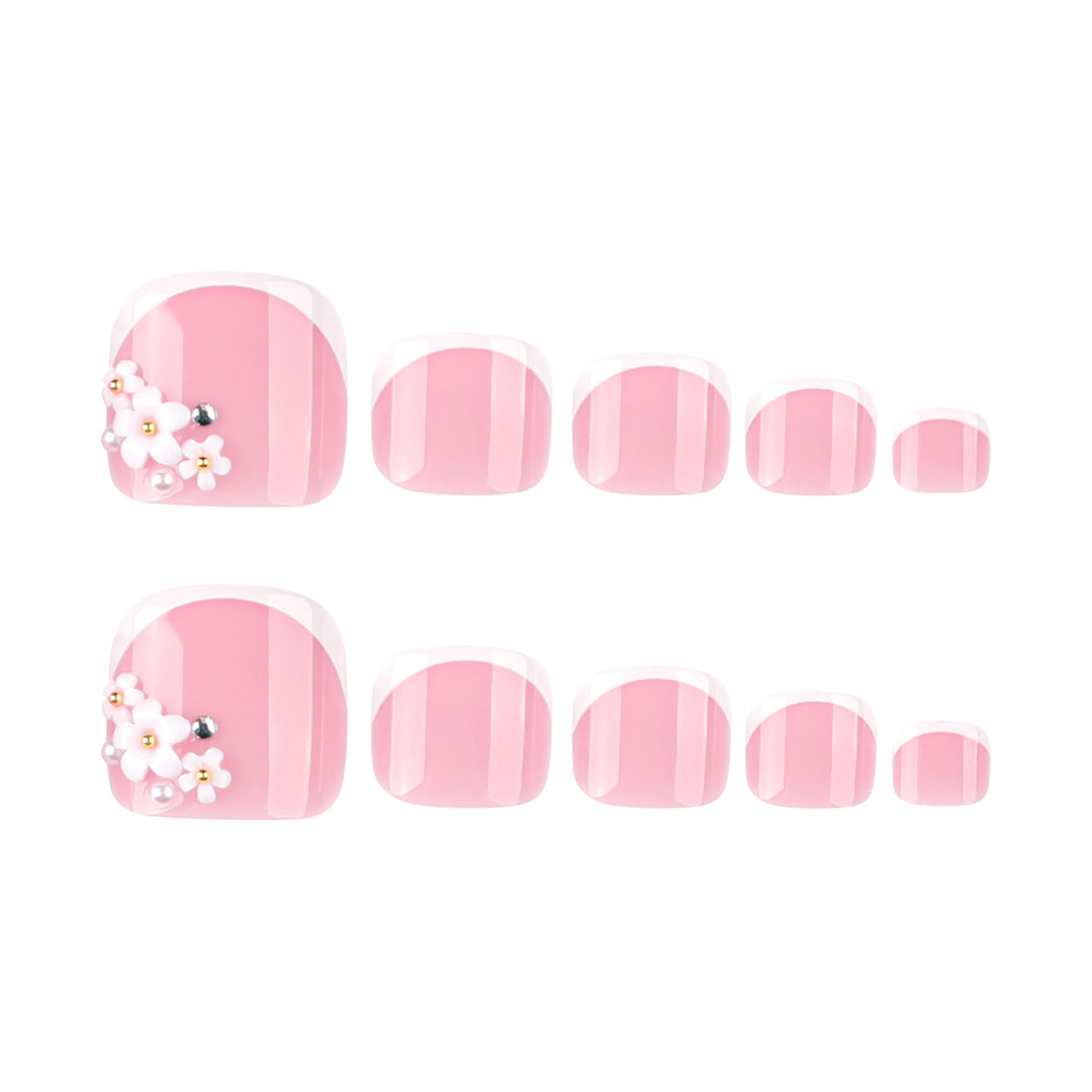 Artful toenail design with delicate flower and French tip accents Kalsten