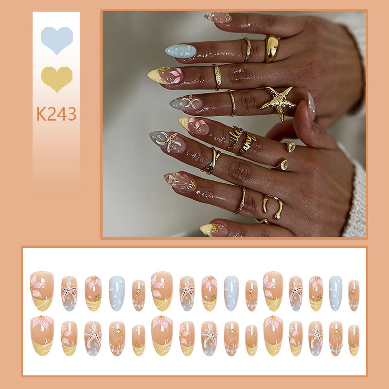 Artificial nail set with floral motifs and glitter accents Kalsten