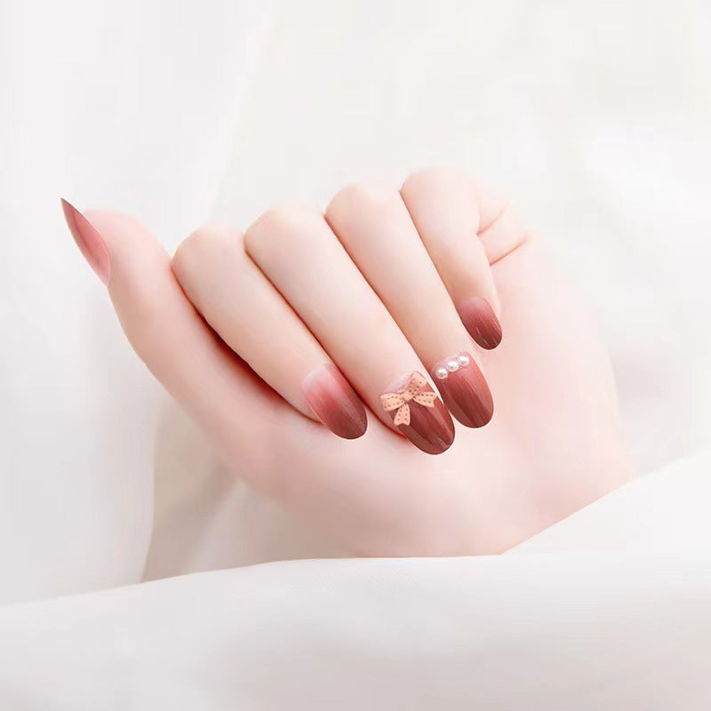 Artificial nails with glamorous bow and pearl decor Kalsten