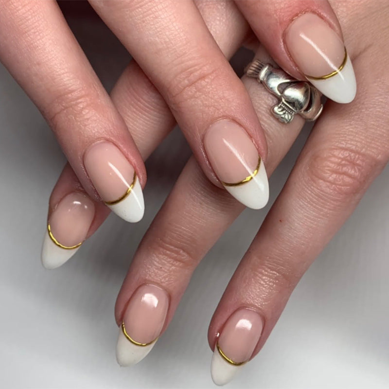 Artistic French-Tip Nails with Gold Accents Kalsten