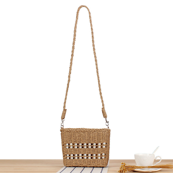 Handbag made of hand-woven natural material with pearl decoration Kalsten