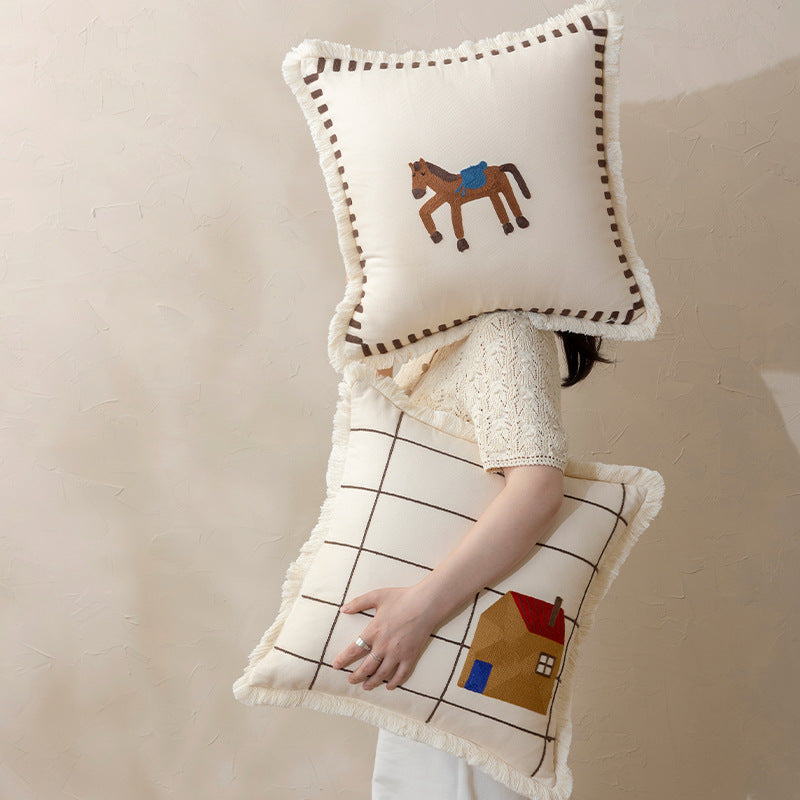 Decorative cushion cover made of cotton blend with fringes, check pattern and embroidered house Kalsten