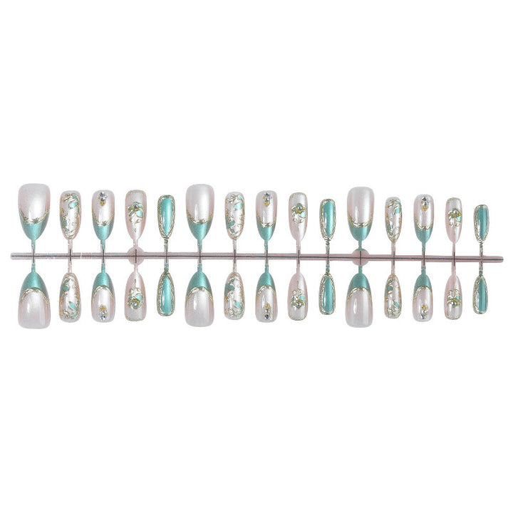 Artificial nail set with luxurious flower appliqués and glitter accents Kalsten
