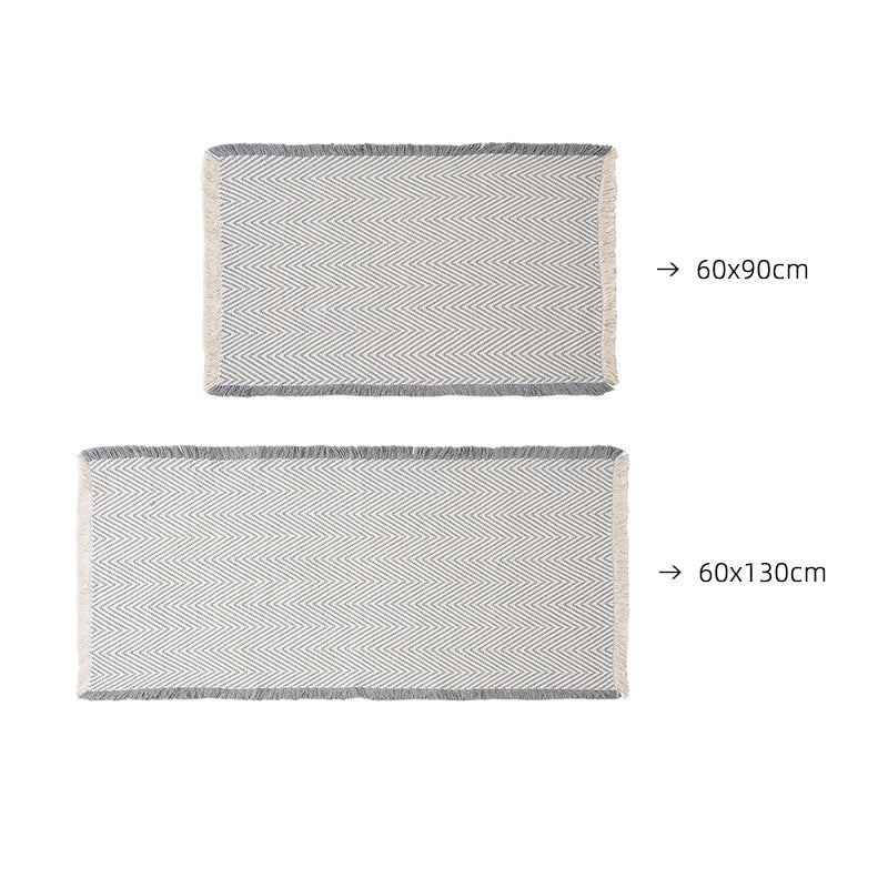 Handwoven cotton bath mat with herringbone pattern and fringes Kalsten