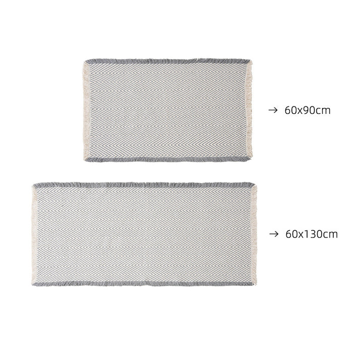 Handwoven cotton bath mat with herringbone pattern and fringes Kalsten