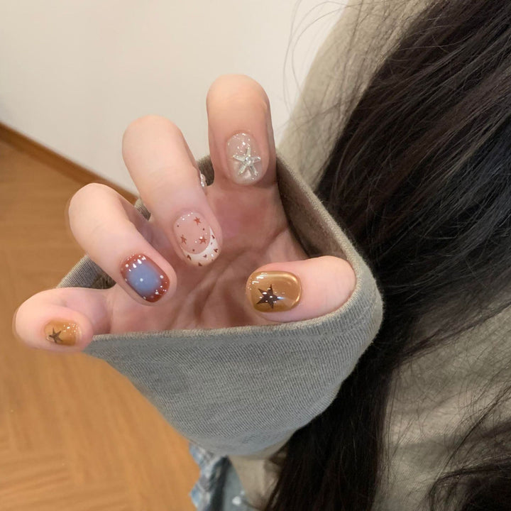 Artificial nails in modern design with star and gradient elements Kalsten
