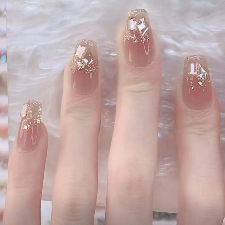 Glamorous artificial nails with delicate flower and glitter effects Kalsten