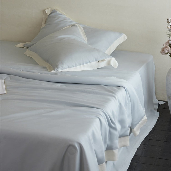 Elegant satin bedding set with silky touch, contrasting border and concealed closure