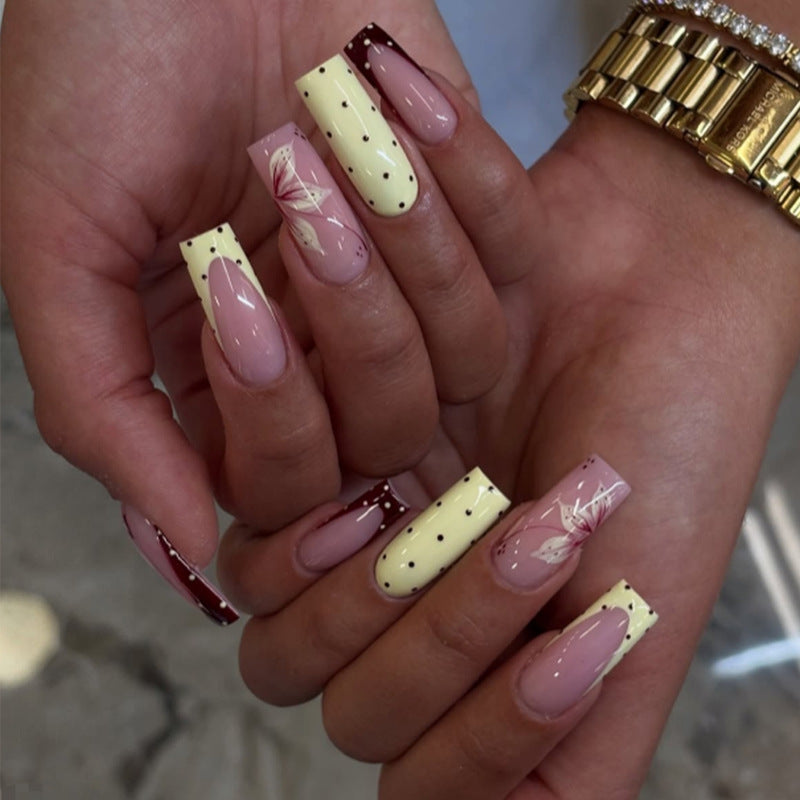 Acrylic nail set with elegant floral and polka dots design Kalsten