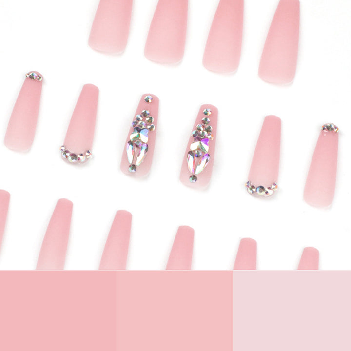Artistic acrylic nails with glitter and rhinestone embellishments Kalsten