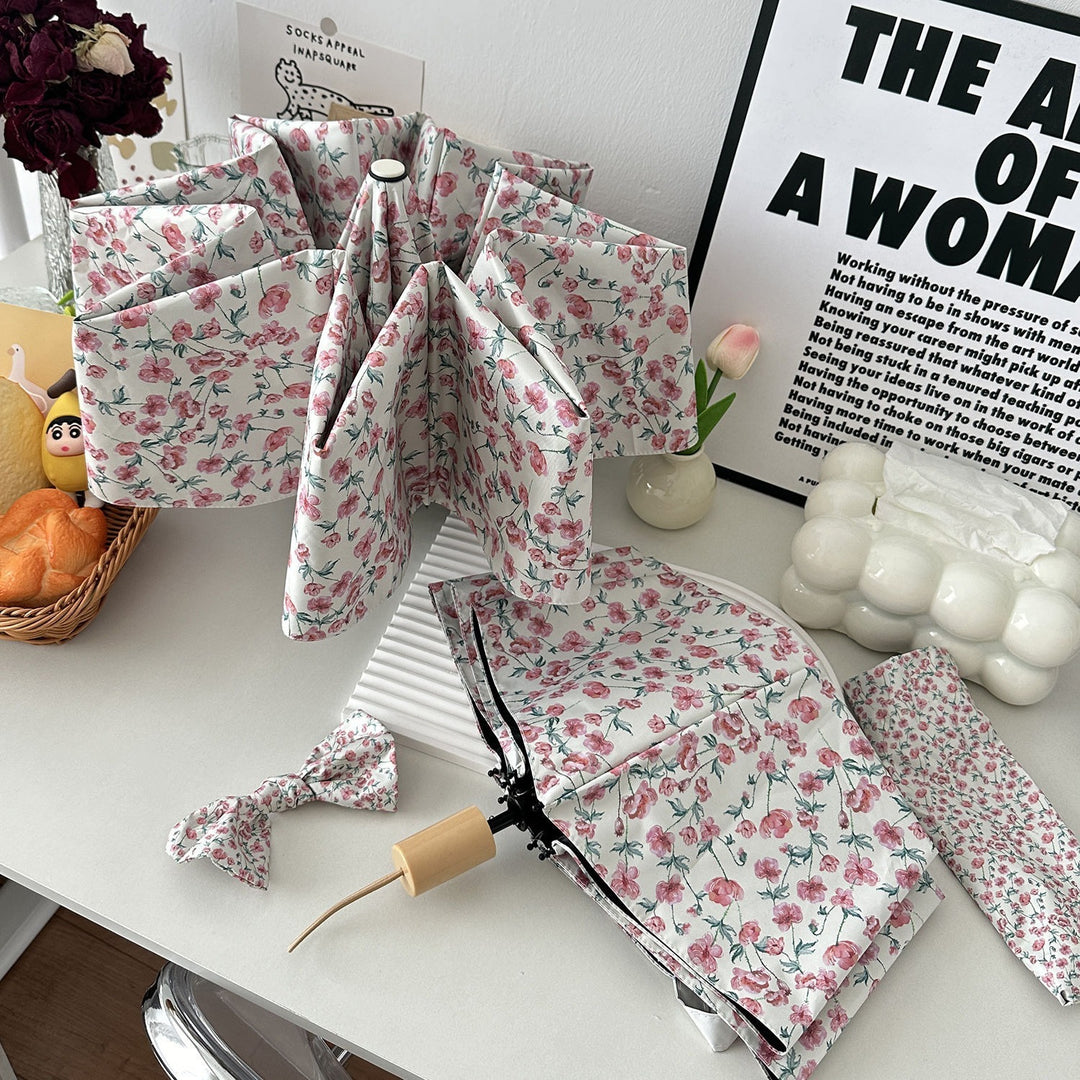 Women's folding umbrella with floral design and practical storage system Kalsten