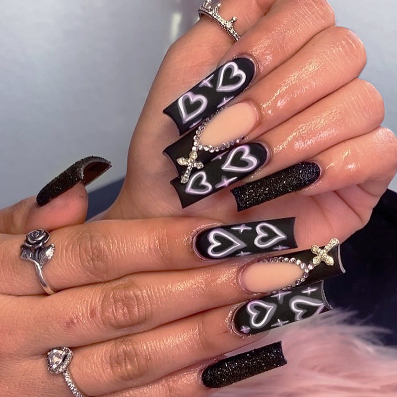 Artificial nail set with elegant glitter and heart designs Kalsten