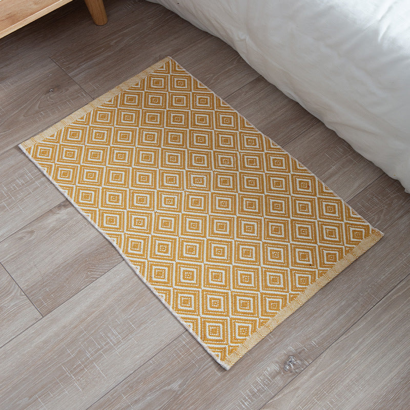Striped cotton doormat with non-slip bottom and decorative woven edge Kalsten