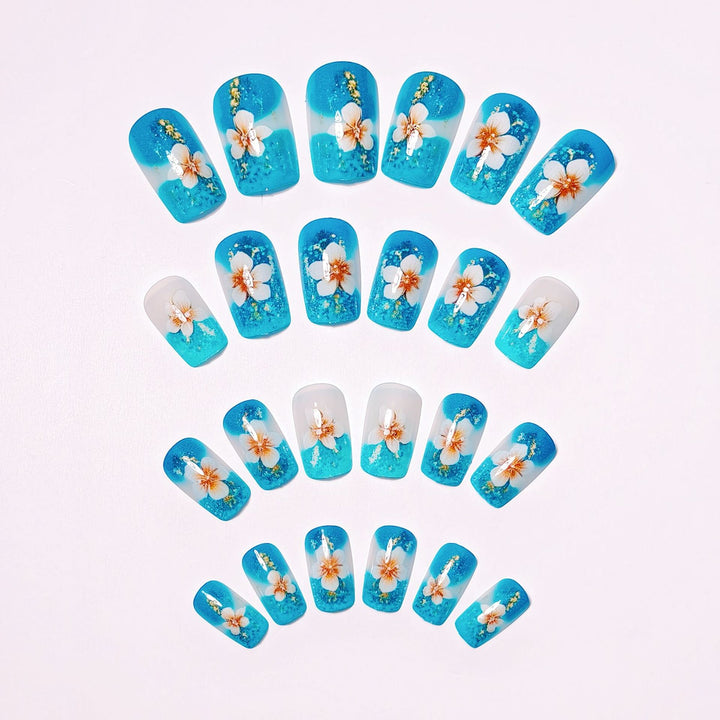 Artificial nails with floral accents and glitter patterns Kalsten