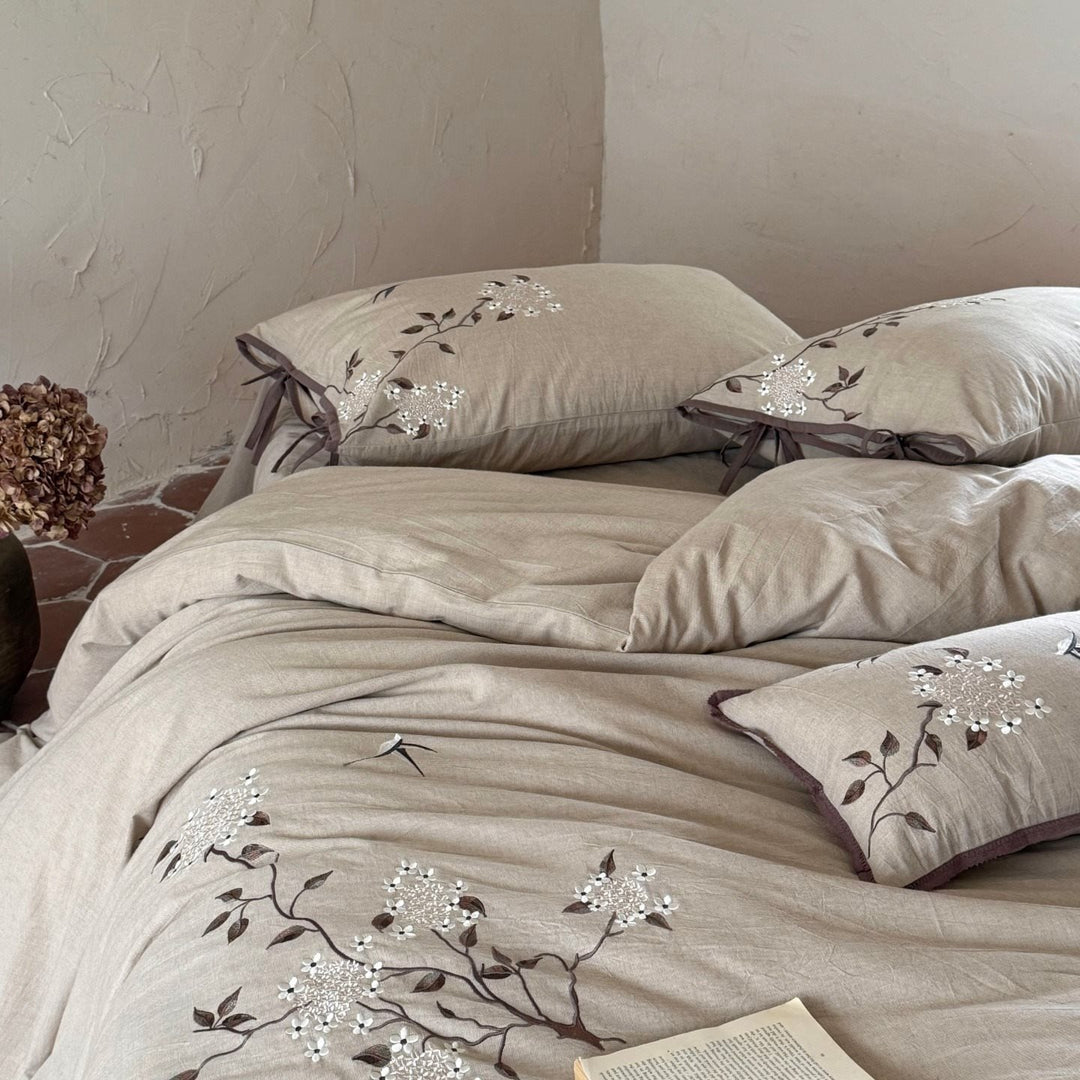 Embroidered bedding set made of linen look with decorative stripes and floral embroidery
