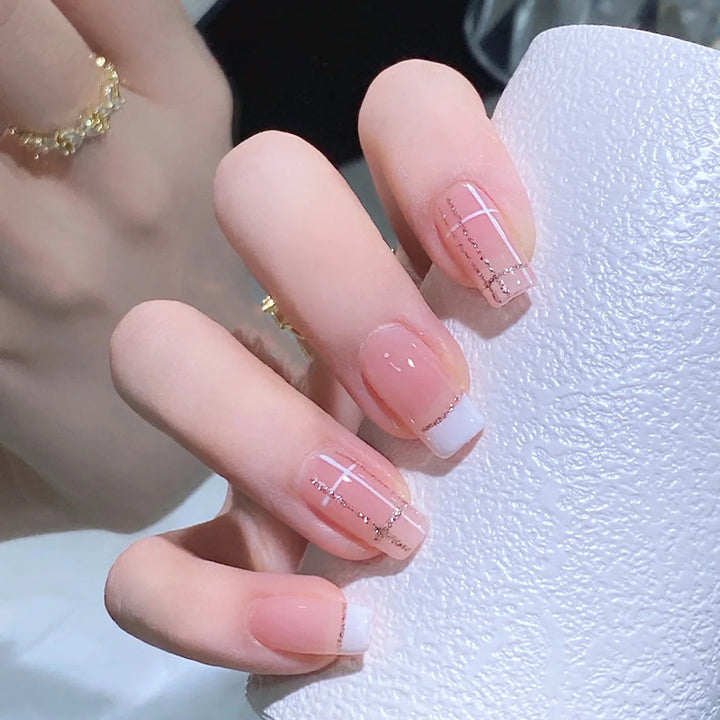 Nail set with elegant French tip and fashionable embellishments Kalsten