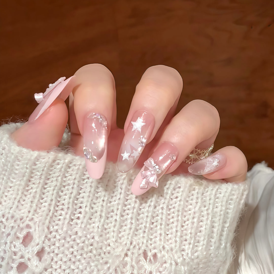 Artificial nail tips with glamorous glitter and bow details Kalsten