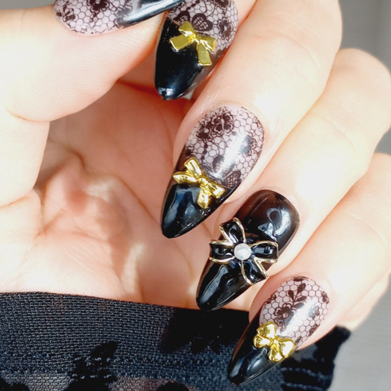 Artificial nail set with elegant dot and bow decorations Kalsten