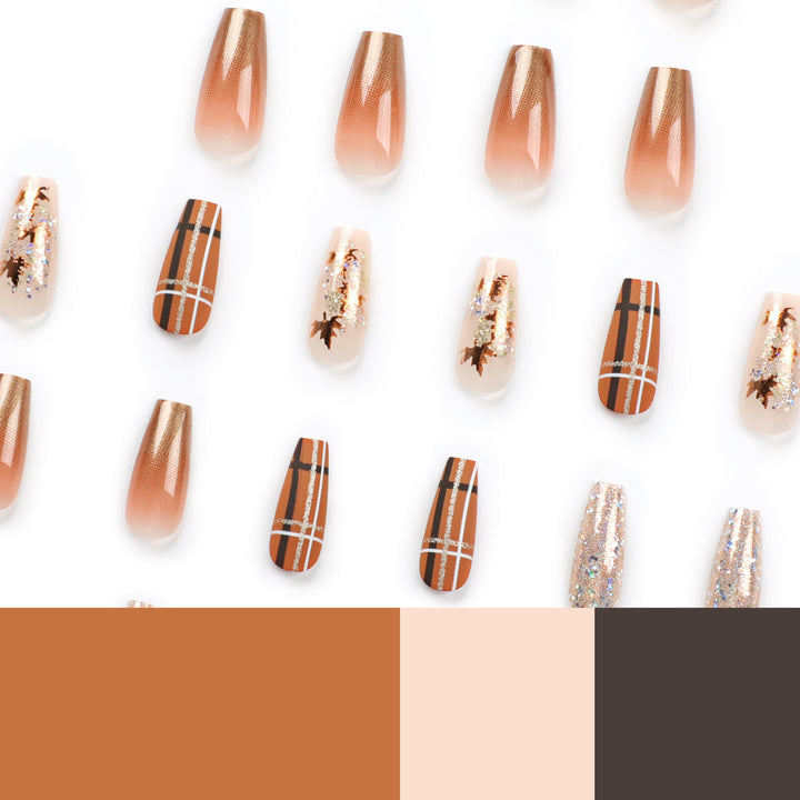 Artful nail extensions with glitter and leaf patterns Kalsten