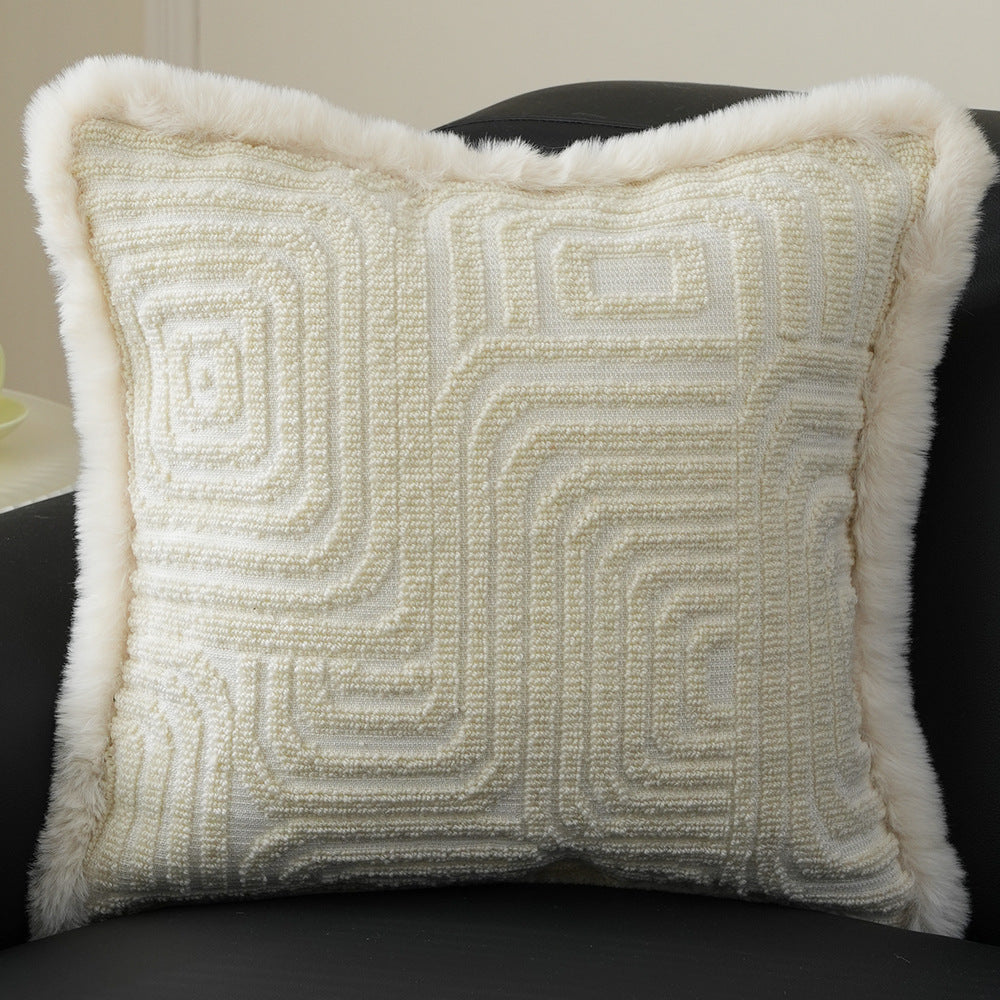 Square decorative pillow with embossed circular relief and soft faux fur edging