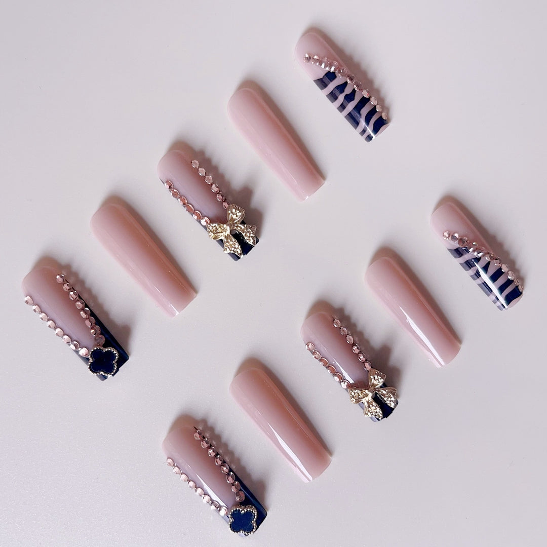 Glamorous artificial nails with elegant design with rhinestones and 3D decorations Kalsten