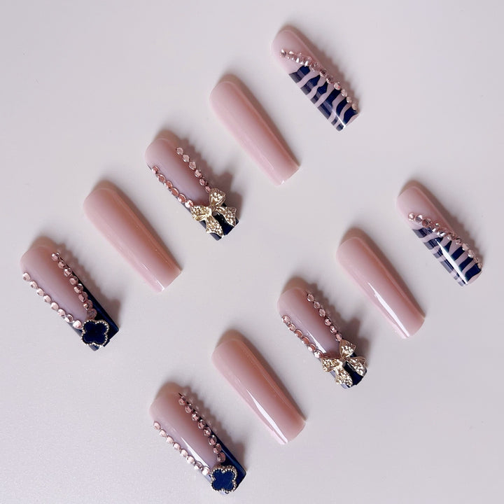 Glamorous artificial nails with elegant design with rhinestones and 3D decorations Kalsten