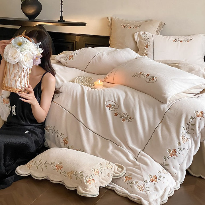 High-quality embroidered bedding set made of cotton percale with ruffled hem and floral relief