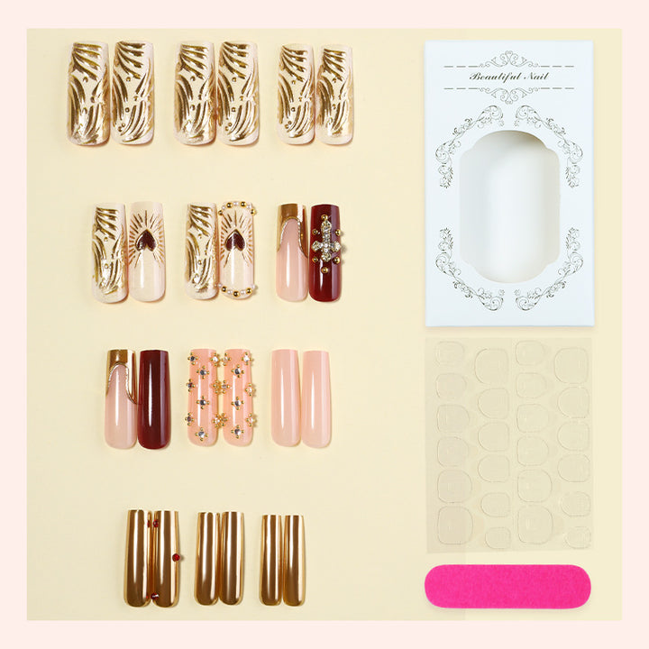 Acrylic nail set with luxurious golden accents and sparkling embellishments Kalsten