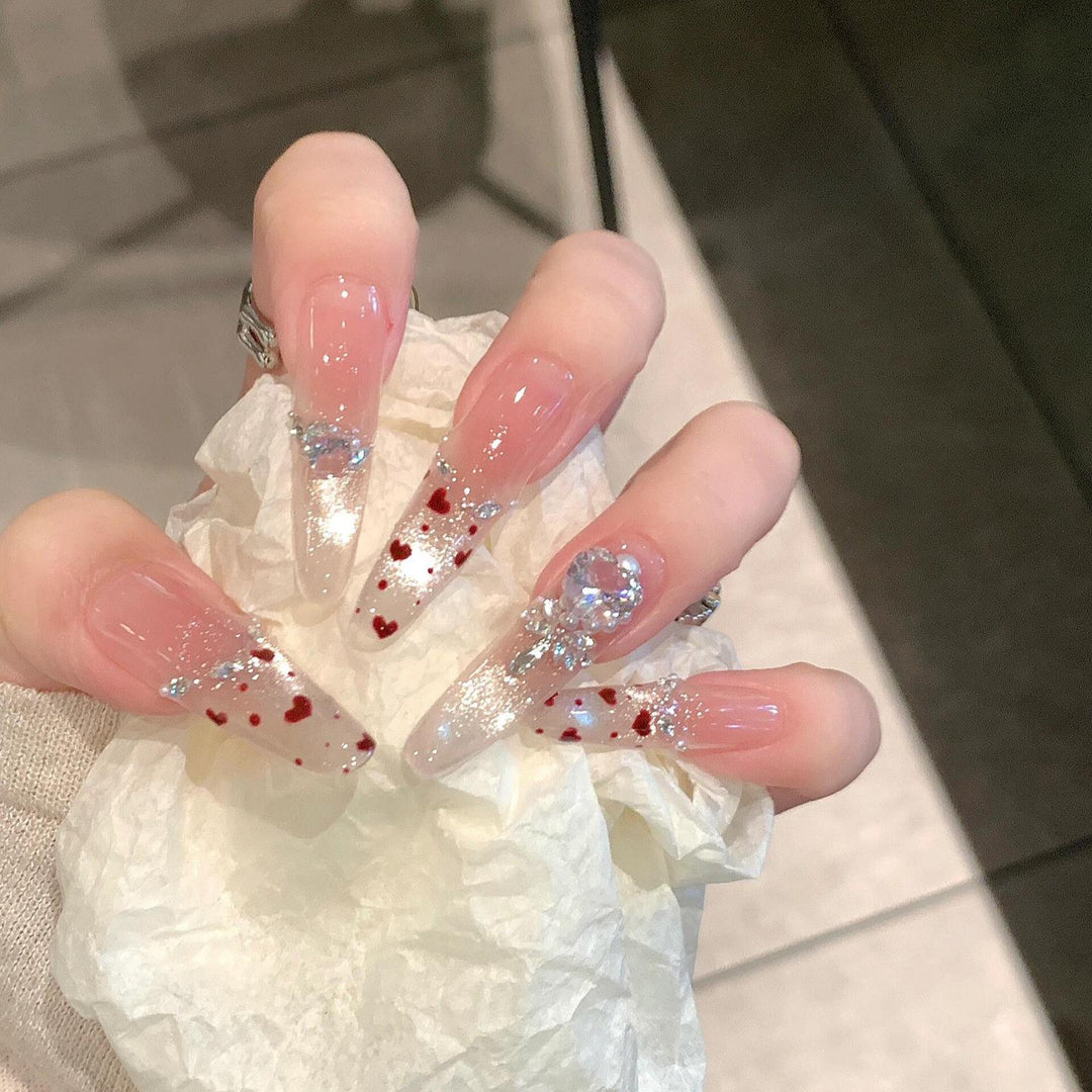 Nail art set with sparkling rhinestones and heart design Kalsten