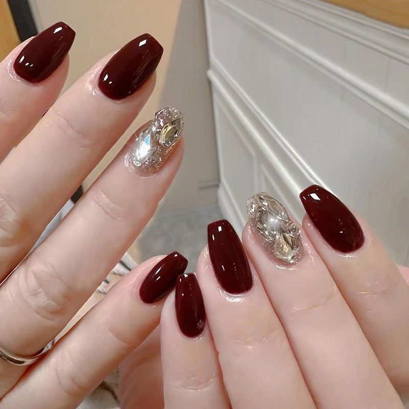 Artfully designed Gel nails with rhinestone decorations Kalsten