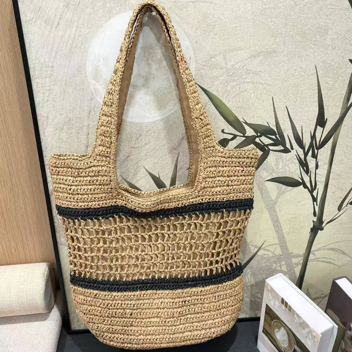 Woven natural material handbag with elegant structure Kalsten