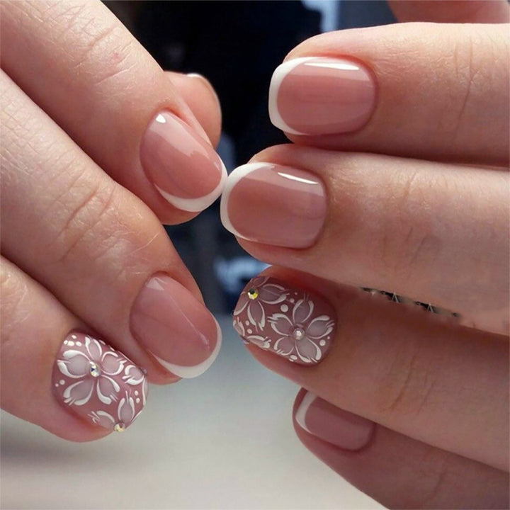Artificial nail set with elegant French design and floral accents Kalsten