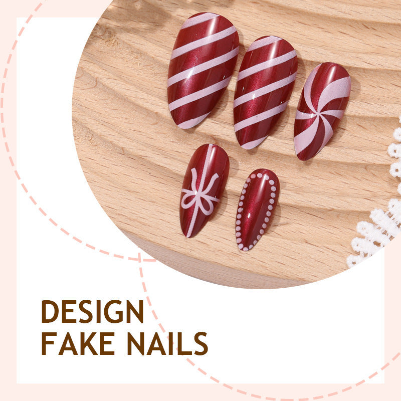 artfully designed nail set with festive candy cane motifs Kalsten