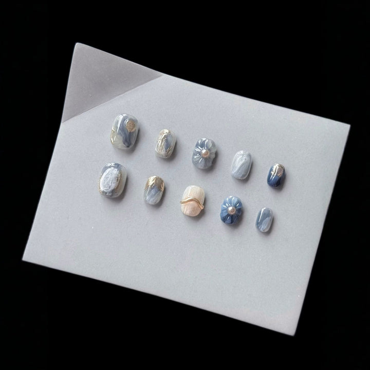 Artistic Press-On Nail Art Set with Unique Floral and Marble Accents