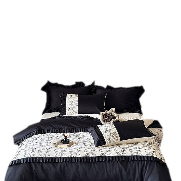 Elegant reversible bedding set made of fine satin with botanical contour print and pleated border