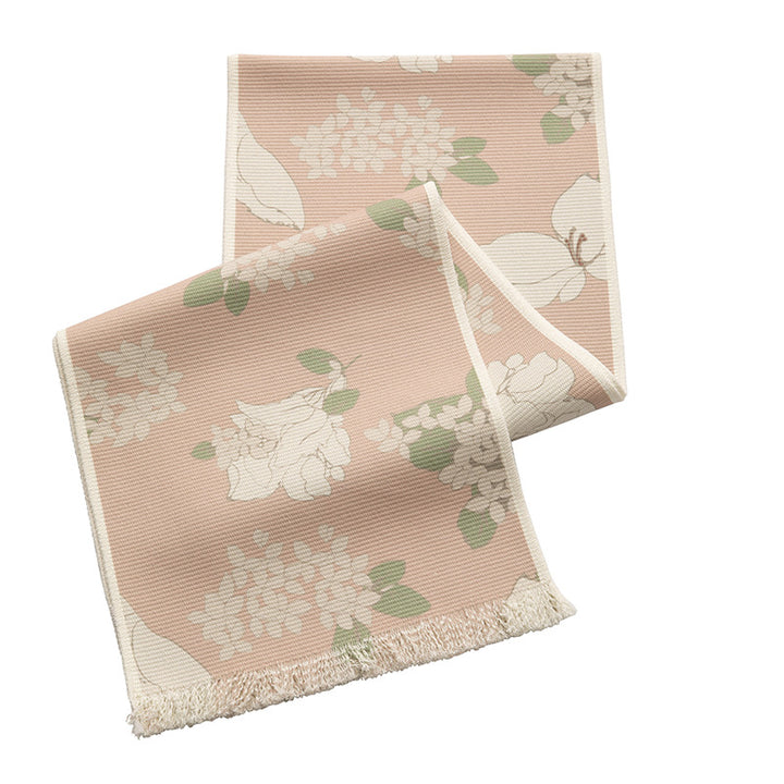 Woven table runner with floral jacquard pattern and fringed edge Kalsten