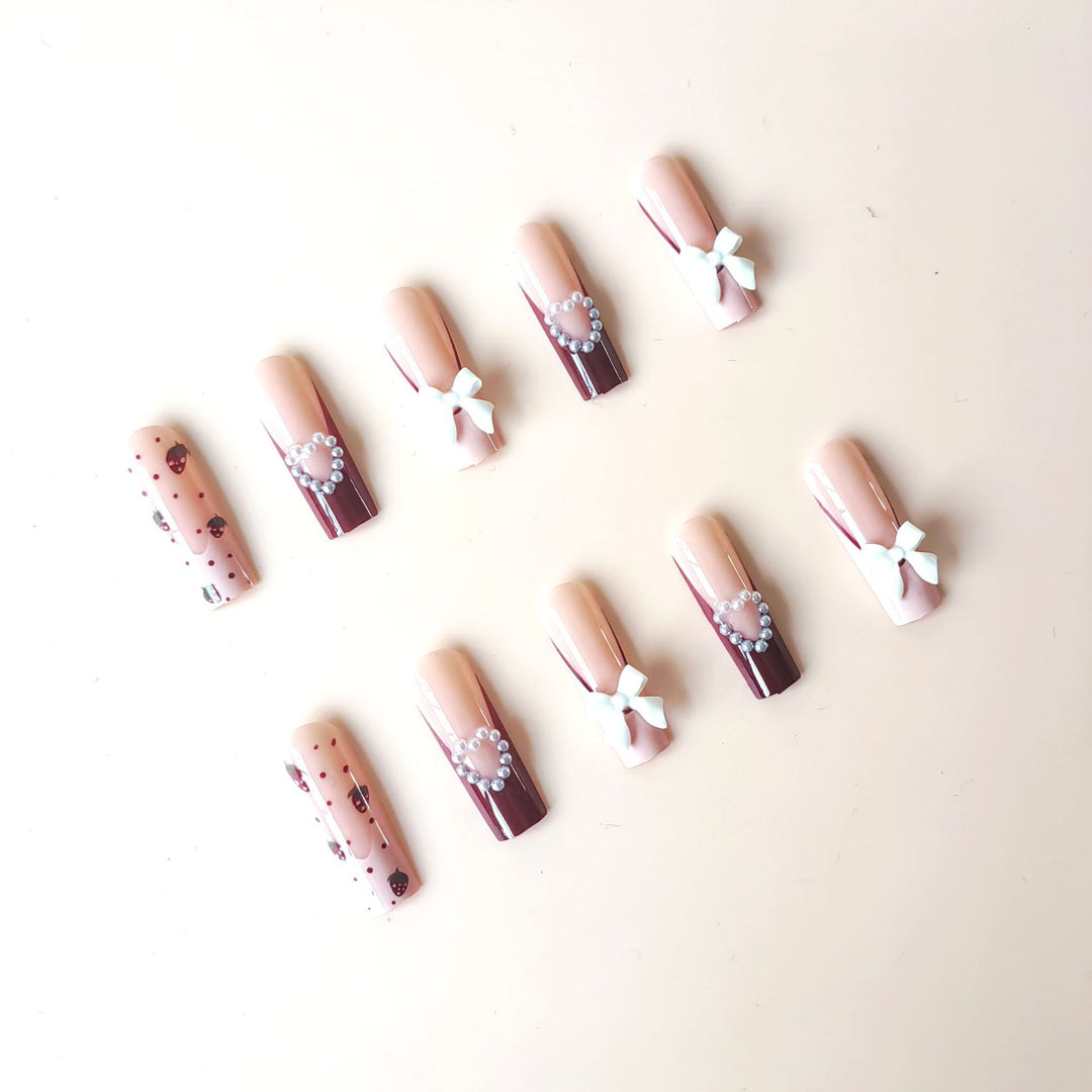 Artificial artificial nails with heart designs and holographic accents Kalsten