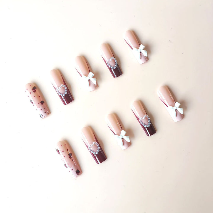 Artificial artificial nails with heart designs and holographic accents Kalsten
