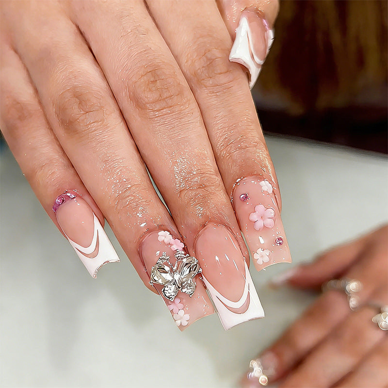 Artificial nails with floral accents and glitter effects Kalsten
