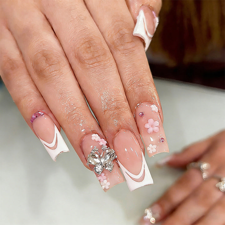Artificial nails with floral accents and glitter effects Kalsten