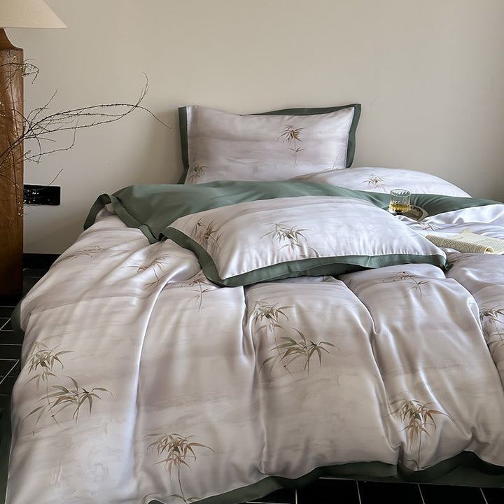 Luxurious satin bedding set with subtle bamboo print and contrasting decorative piping