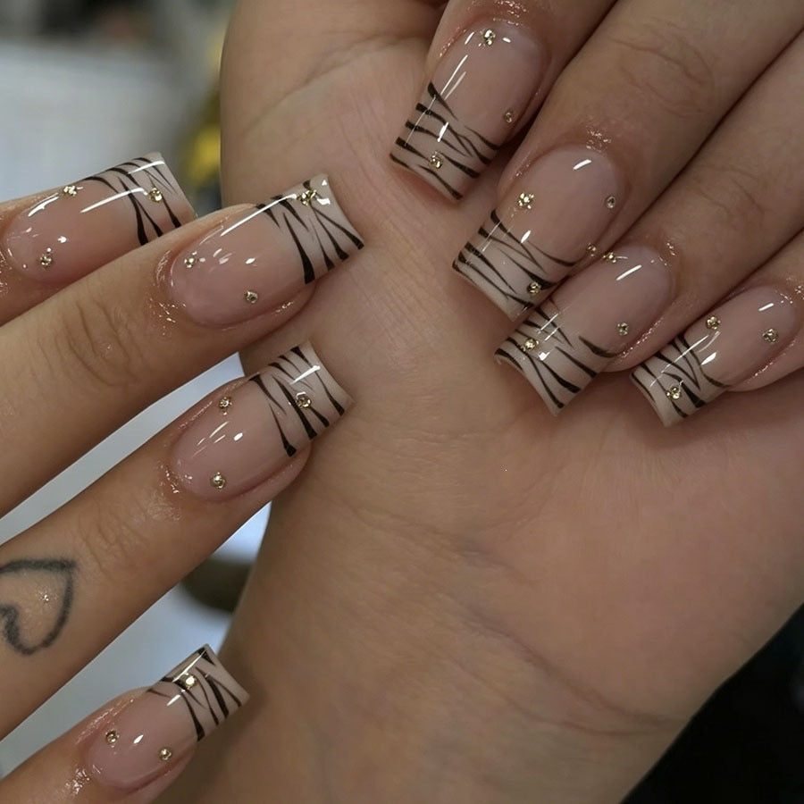 Art nail set with elegant lines and glitter accents Kalsten