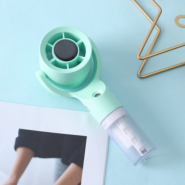 Cooling handheld misting fan with swivel air head detachable water reservoir and USB rechargeable battery Kalsten