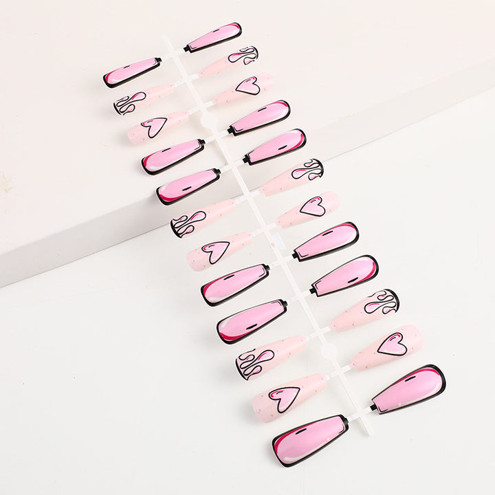 Eye-catching artificial nails with soulful heart design and glamorous accents Kalsten