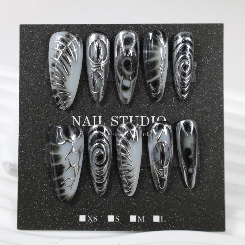 Artificial nail set with modern spiral pattern and shiny accents Kalsten