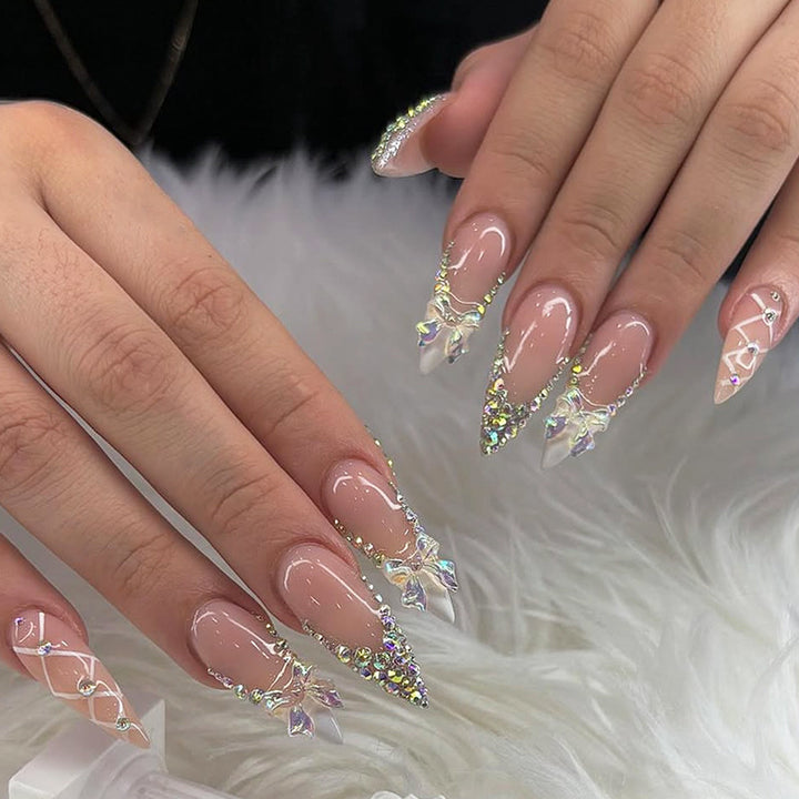 Acrylic nail set with luxurious rhinestone embellishments and bow accents Kalsten