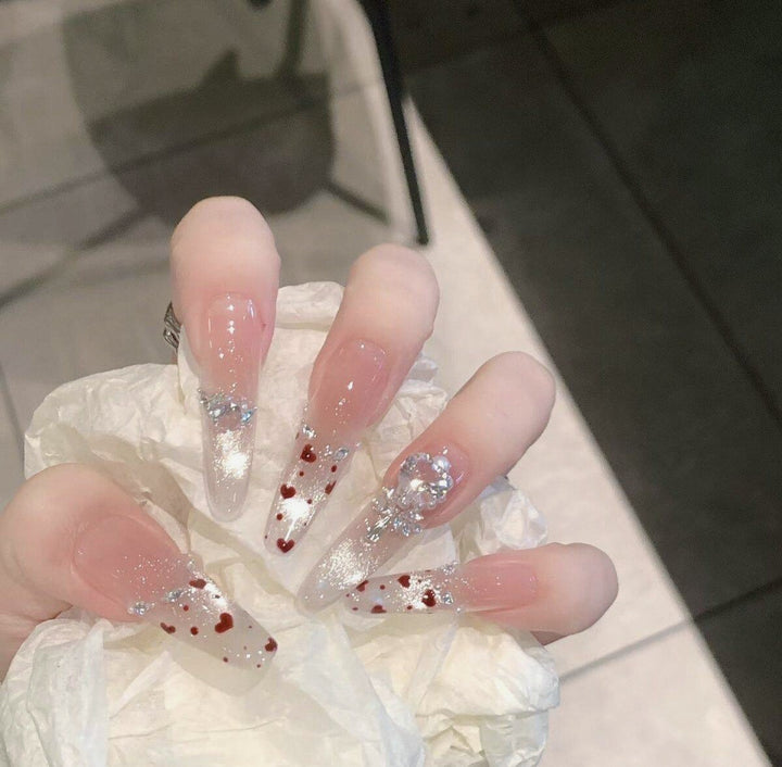 Artistic Stiletto Press-On Nail Art with Glimmering Accents Kalsten