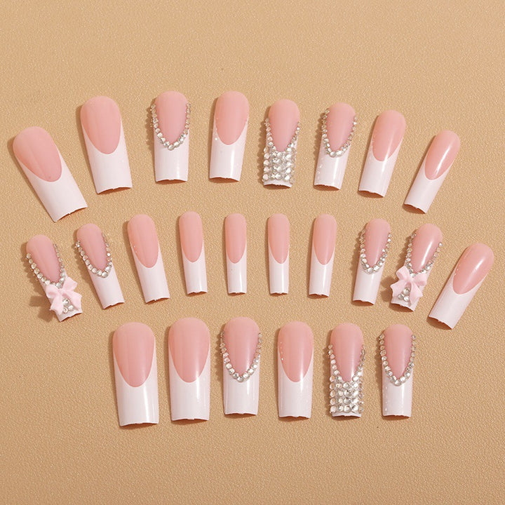 Artificial nails with glamorous rhinestone decorations and floral accents Kalsten