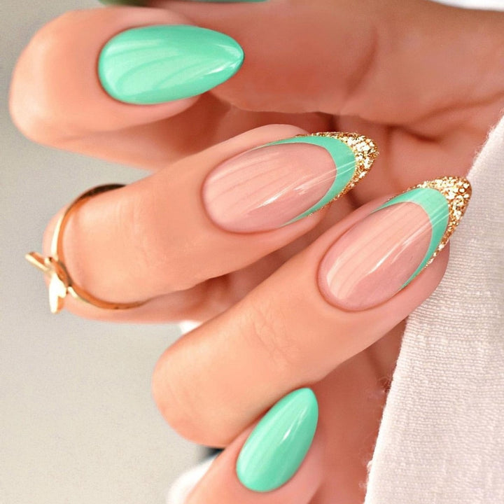 Artificial nail creation with glamorous tips and glitter details Kalsten